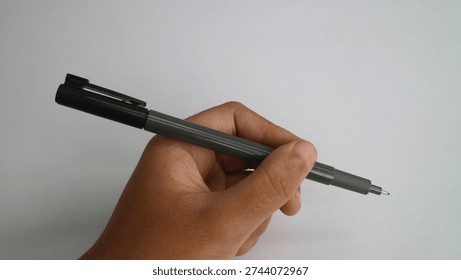 Ready to Write: Hand Holding a Precision Fineliner Pen