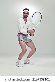 Ready For Your Serve. Portrait Of A Young Retro Tennis Player In The Studio.