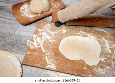 ready-to-cook dough, freshly kneaded by a small child. kitchen u