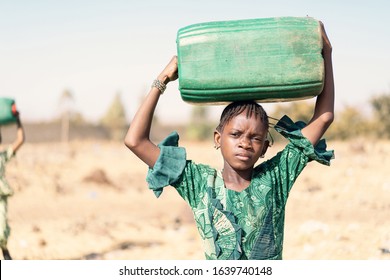 Real Aboriginal Woman getting Healthy Water for a lack of water symbol