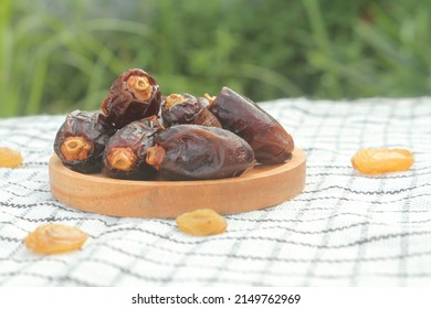 Real ajwa dates have a very dark black color, but there are also red ones. Dates as iftar food, Middle Eastern fruit