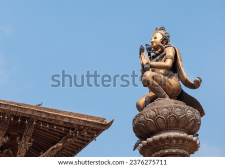 Real art masterpiece in old temple decorations statue of Garuda god of birds on Patan Durbar Square royal medieval palace and UNESCO World Heritage Site. Lalitpur, Nepal.  