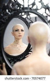 Real Bald Cancer Survivor Woman Looking Calmly Into The Mirror