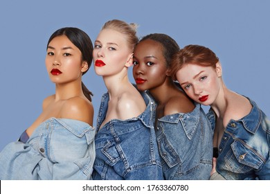 The Real Beauty Exists In Every Corner Of The World And Is Presented By Women Of All Races. Four Beautiful Ladies In Denim Shirts And With Different Skin And Hair Colour Are Posing In A Row.