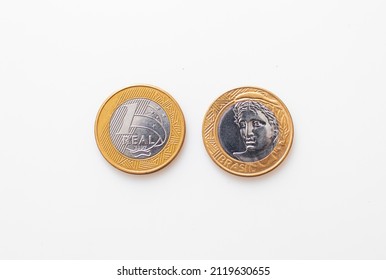 Real - BRL, Brazilian currency. Two 1 Real coins isolated on white background. Front side and back side.
