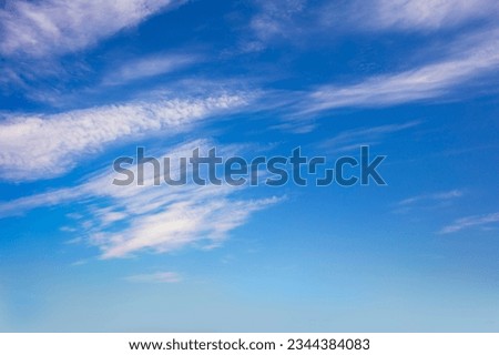 Real clear day sky - real blue sky during daytime with white light clouds Freedom and peace. Cloudscape blue sky. 