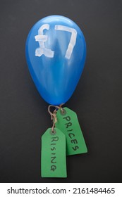 Real Coloured Blown Up Balloon With Sterling Sign And Pounds Number Symbolising Rising  Prices The Increasing Cost Of Living. Concept Or Metaphor For Inflation Flying High