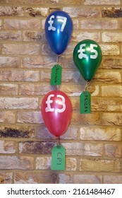 Real Coloured Blown Up Balloon With Sterling Sign And Pounds Number Symbolising Rising  Prices The Increasing Cost Of Living. Concept Or Metaphor For Inflation Flying High