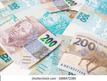 Real Currency ( BRL ), Money From Brazil. Dinheiro, Reais, Real Brasileiro, Brasil. A Group Of Brazilian Banknotes In Close Up.