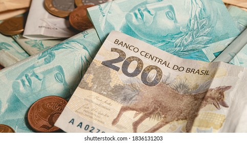 Real currency, money from Brazil. Dinheiro, Reais, Real Brasileiro, Brasil. A Brazilian banknotes in close up. - Shutterstock ID 1836131203
