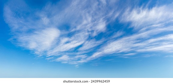 Real day sky - real blue sky during daytime with white light clouds Freedom and peace. Large photo format Panoramic. Cloudscape blue sky. Without any birds.  - Powered by Shutterstock