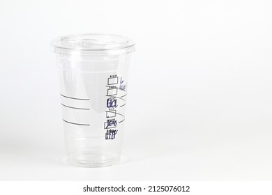 Real Empty Plastic Clear Cup With Flat Lid And Checkbox For Mark Detail On Side Isolated On White.