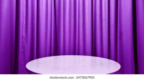 real empty round marble table with purple curtain background used for premium, luxury, deluxe concept. podium under spot light with violet wavy drapery at background for product display.