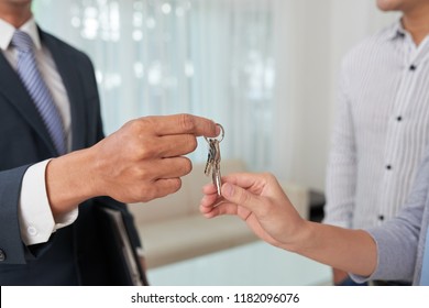 Real Estate Agent Giving House Keys To Client