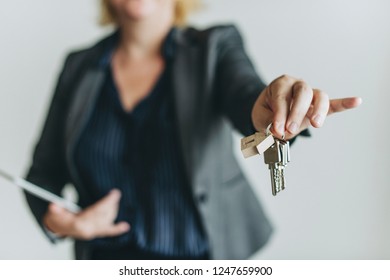 Real Estate Agent Handing Over The Keys