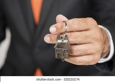 Real Estate Agent Handing Over House Keys
