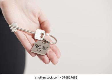 Real Estate Agent Handing Over House Keys 