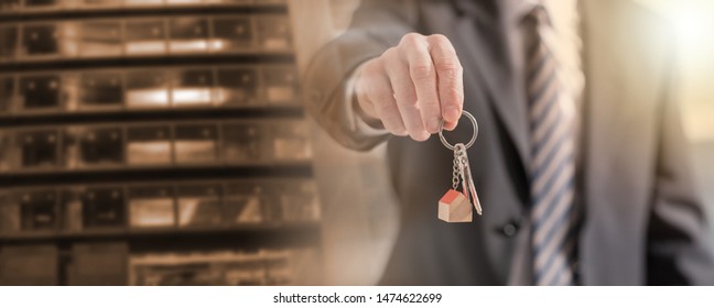 Real Estate Agent Offering House Keys; Multiple Exposure