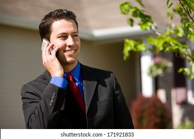 Real Estate: Agent On Phone With Buyers