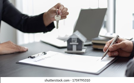 Real estate agent or sales manager has proposed terms and conditions to customers who sign house purchase agreements with insurance, Agreement to sign the purchase contract concept.