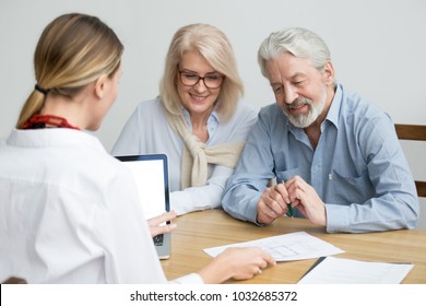 Real Estate Agent Showing House Plan To Aged Couple, Realtor Making Property For Sale Offer To Senior Customers At Meeting, Financial Advisor Consulting Older Family Negotiating About Buying New Home