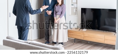 Real estate agent showing the house