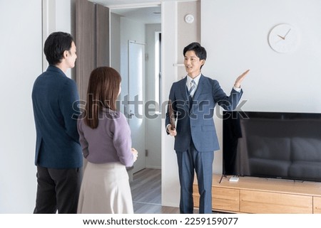 Real estate agent showing the house