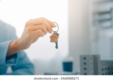 Real estate agent talked about the terms of the home purchase agreement and asked the customer to sign the documents to make the contract legally, Home sales and home insurance concept. - Powered by Shutterstock