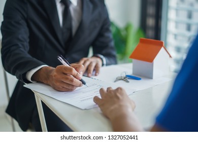 Real Estate Agent Writing Signing Agreement Stock Photo 1327052441 ...