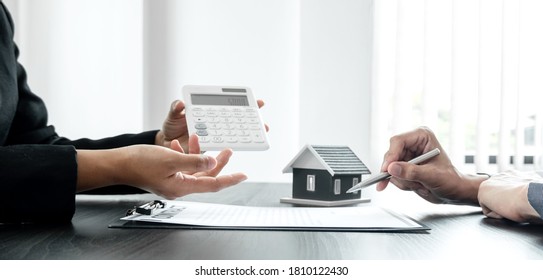 Real estate agents have a rental contract form for customers to sign a contract by the formal rental agreement Rental and insurance concepts. - Shutterstock ID 1810122430