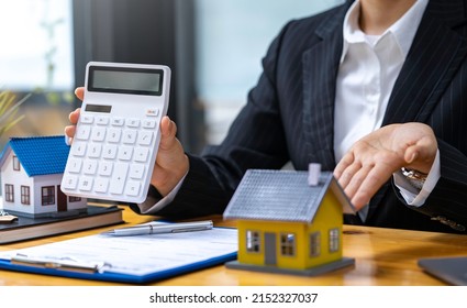 Real estate agents offer home equity loans to their customers to decide to insure their rental homes and land. home mortgage ideas and home refinancing - Shutterstock ID 2152327037