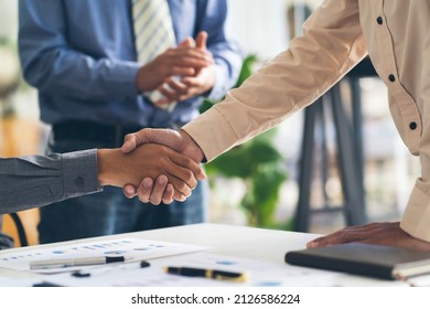 Real Estate Broker Agent And Customer Shaking Hands After Signing Contract Documents For Realty Purchase, Bank Employees Congratulate, Concept Mortgage Loan Approval.