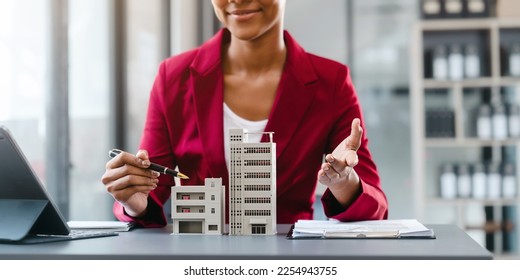 Real estate broker agent working and consult online to decision making sign a contract, Attractive young business woman african american lawyer at desk - Shutterstock ID 2254943755