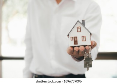 Real estate broker residential house rent listing contract. Offer of purchase house, rental of Real Estate. Giving, offering, demonstration, handing house keys. - Shutterstock ID 1896739096