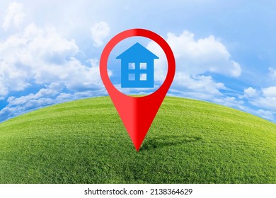 Real Estate And Building Activity Concept With A Vacant Land On A Green Field Available For Building Construction - Concept With Red Location Pin Point Icon