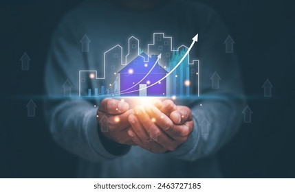 Real estate business concept, Man holding virtual screen of city hologram and growing business graph, Real estate economic growth analysis, The target of business. Residential development project. - Powered by Shutterstock