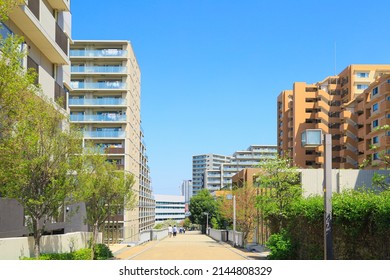 Real estate concept: Apartment, condominium, office buildings against the blue sky.  A residential area in the suburb of Tokyo, Japan.