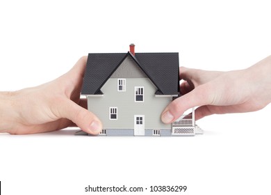 Real Estate Concept - Two Hands Trying To Divide House, Isolated