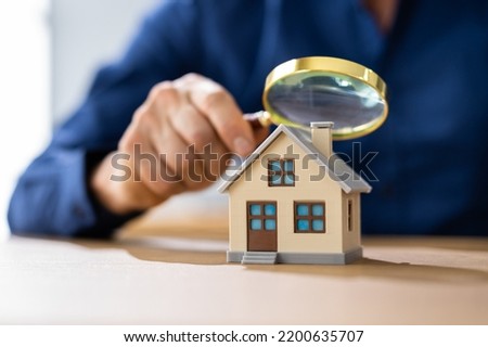 Real Estate House Appraisal By Inspector With Magnifier