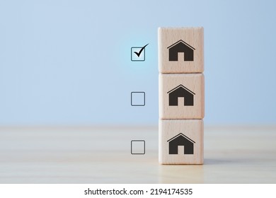 Real Estate. House And Property Investment And Asset Management Concept. Interest Rates, Loan Mortgage, House Tax. Select House Icon On Wooden Block. Choose The Best.