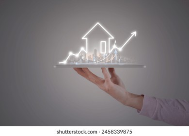 real estate investment concept energy efficiency rating and property value, Real estate online on virtual screens. hand holding digital tablet and virtual chart - Powered by Shutterstock