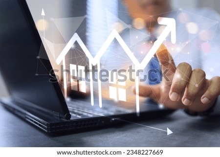 Real estate investment, investor buy a house land location. Investor work on laptop computer to invest real estate in office click on increase graph arrow. Facility management concept.