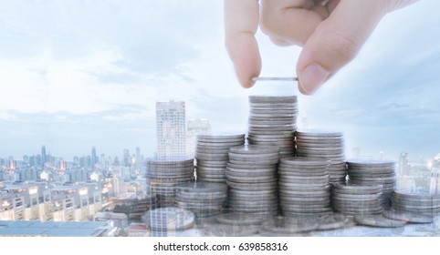 Real Estate Investment,property Fund, Finance Concept. Hand Putting Coin On Coins Stack With City Background.