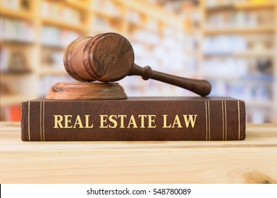 real estate law books and a gavel on desk in the library. concept of legal education. - Shutterstock ID 548780089