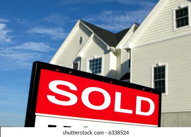 Real Estate Lawn Sign Sold Rider Insert In Front Of A House For Sale By Realtor In A Residential Neighborhood