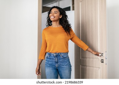 Real Estate Purchase. Happy Black Young Woman Entering Apartment Opening Entry Door Looking Aside At Living Room. New House, Property Ownership Concept - Shutterstock ID 2198686339