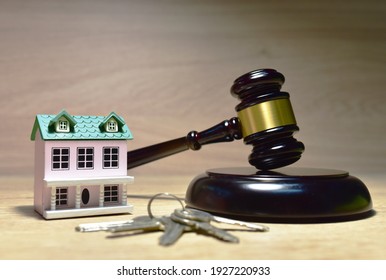 Real Estate Purchase and Sale Transaction Litigation. Sale of Real Property Lawyer. Seller backs out of transaction. House, keys and Mallet of judge in courtroom. Legal excuse and Justice concept. 
