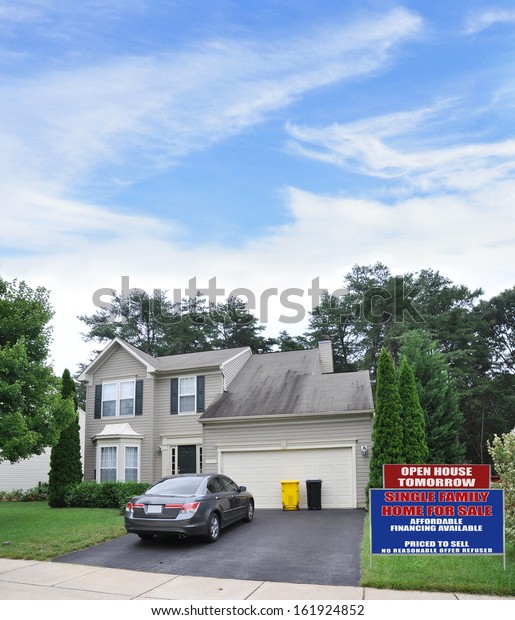 Real Estate For Sale Open House Sign Front yard\
Lawn Suburban Home Parked Car Blacktop Driveway Residential\
Neighborhood USA Blue Sky Clouds\
