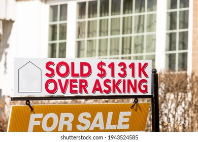 A Real Estate For Sales Sign With  A Sold $131K Over Asking Notice Suggesting A Hot Or Overheated Housing Market