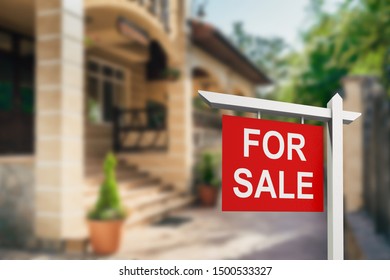 Real Estate Sign In Front Of New House For Sale